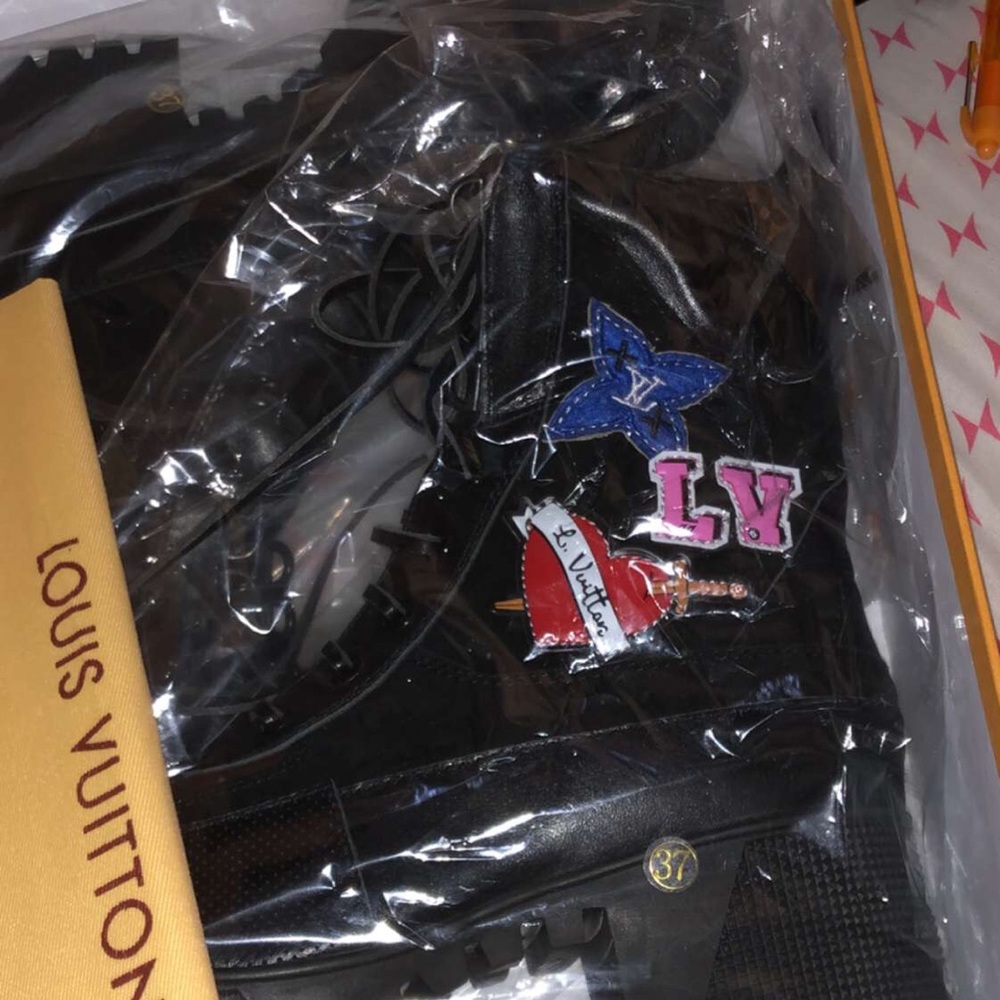 Louis Vuitton boots.